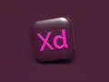 Ikona Adobe XD w kolorze fuksji na ciemnofioletowym tle.