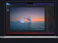 Edycja zdjęcia lodowca z żaglówką w programie Luminar Neo. Widok ekranu laptopa z interfejsem programu.