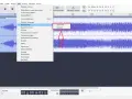 Audacity po polsku: menu "Efekt" z opcjami "Zgłośnienie" i "Ściszenie" na fali dźwiękowej.