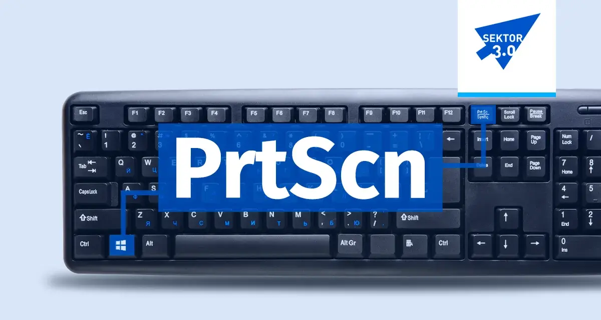 Klawiatura z widocznym napisem "PrtScn" na niebieskim tle. To wycinek ekranu skrót do robienia zrzutów.