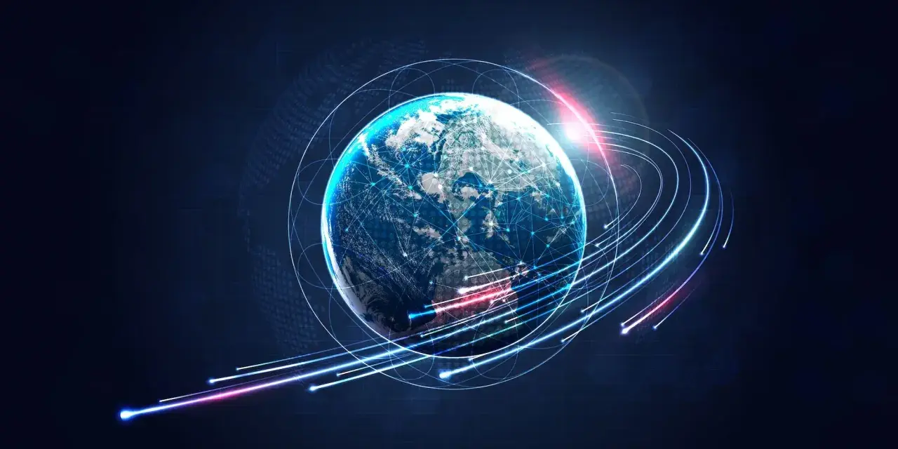 Ziemia otoczona siecią połączeń, symbolizująca globalną komunikację. Odpowiada na pytanie, kiedy powstał internet, pokazując jego wszechobecność.