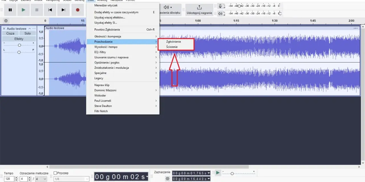 Audacity po polsku: menu "Efekt" z opcjami "Zgłośnienie" i "Ściszenie" na fali dźwiękowej.