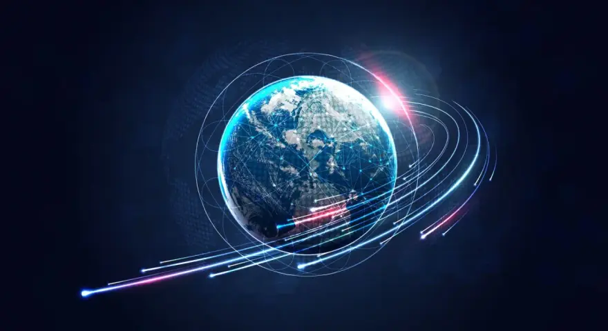 Ziemia otoczona siecią połączeń, symbolizująca globalną komunikację. Odpowiada na pytanie, kiedy powstał internet, pokazując jego wszechobecność.