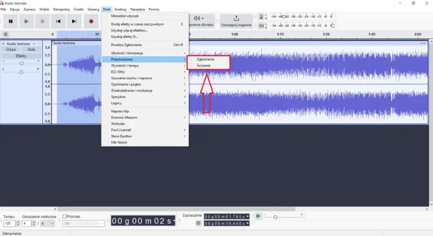 Audacity po polsku: menu "Efekt" z opcjami "Zgłośnienie" i "Ściszenie" na fali dźwiękowej.